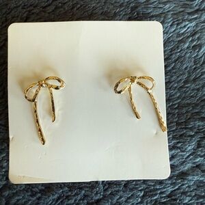 NWOT bow earrings in gold about 1 inch long